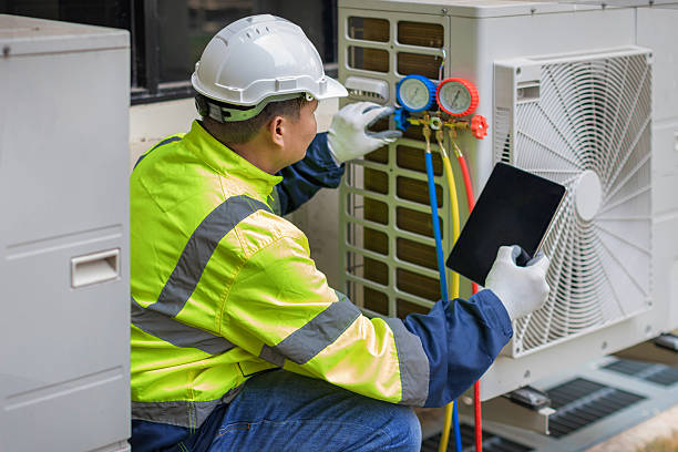 Professional Air Conditioning Repair technician working in Brookline Village, MA